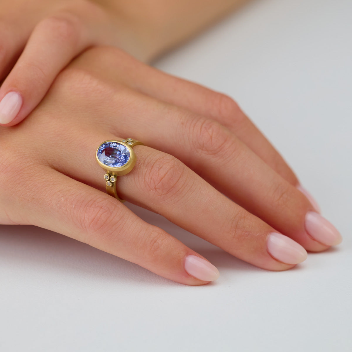 Oval Sapphire Ring with Diamond Trios