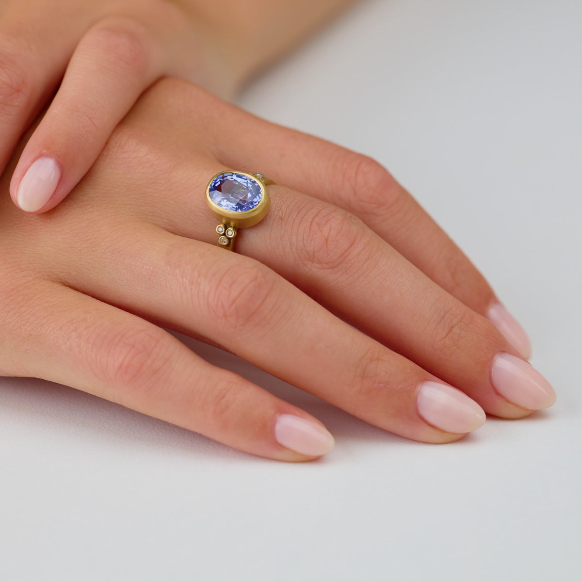Oval Sapphire Ring with Diamond Trios