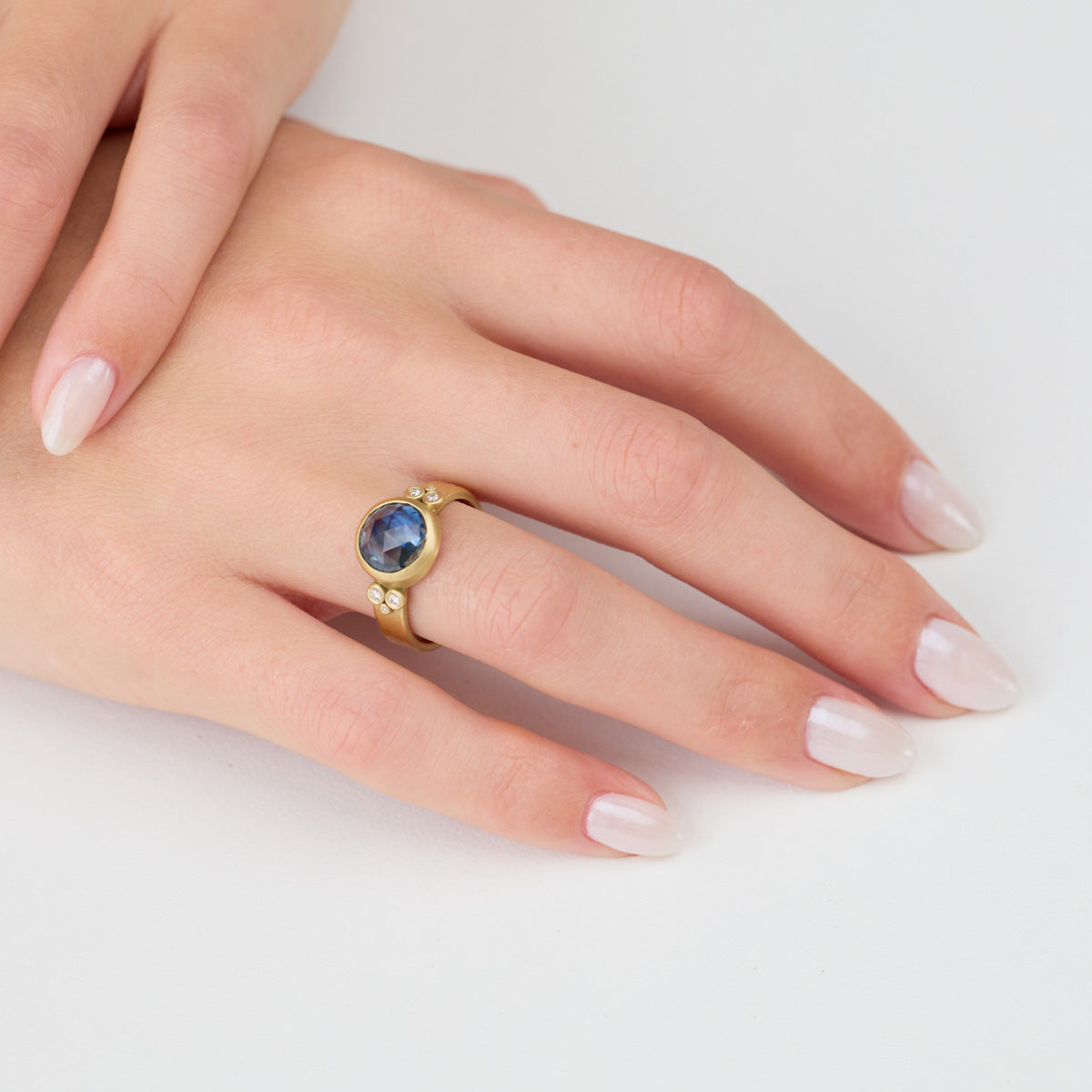 Glowing Blue Sapphire Ring with Diamonds