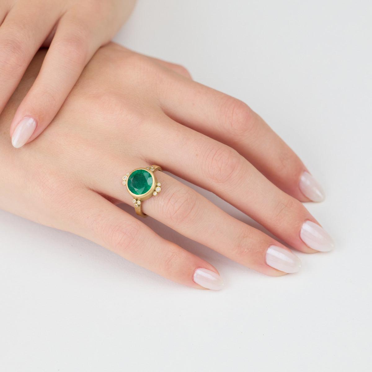 Round Emerald Ring With Diamond Trios