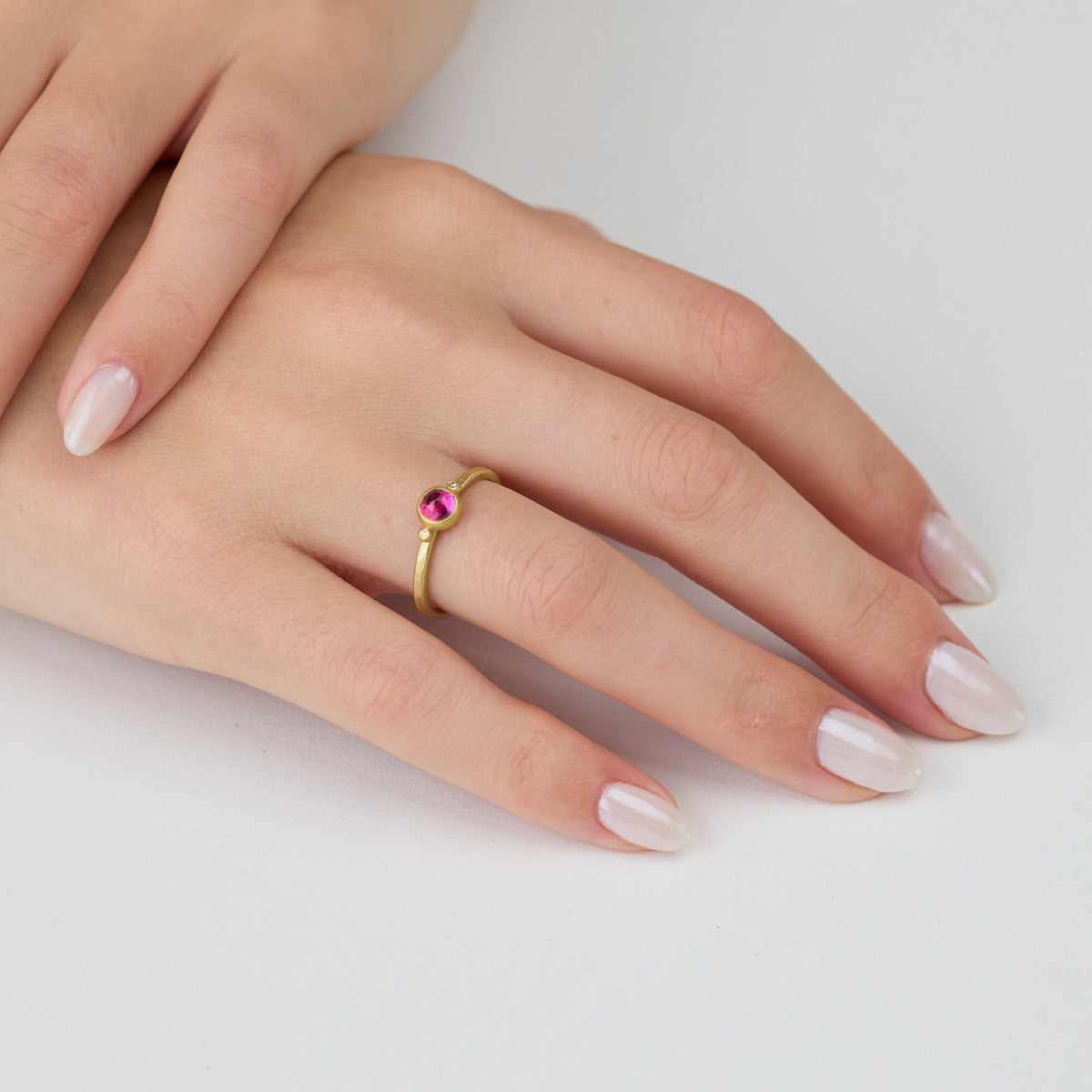 Delicate Ruby Ring with Two Diamonds