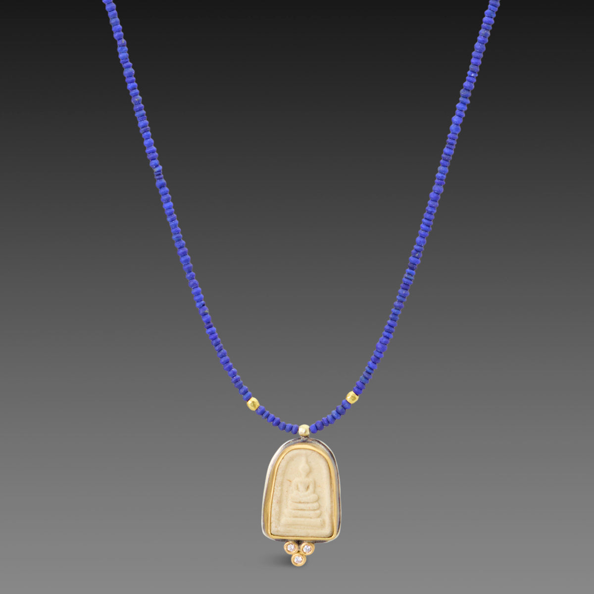 Buddha Amulet on Lapis Strand