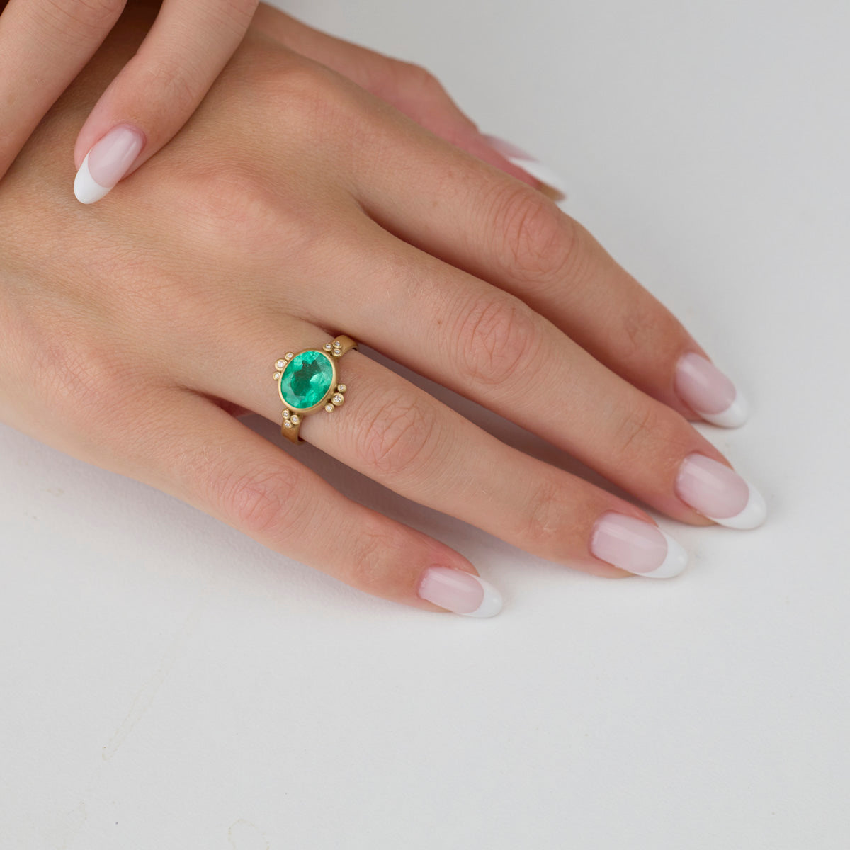 Oval Emerald Ring With Diamond Trios