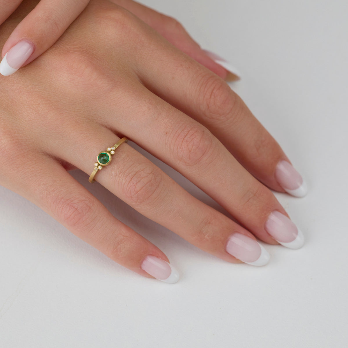 Delicate Emerald Ring with Diamond Trios
