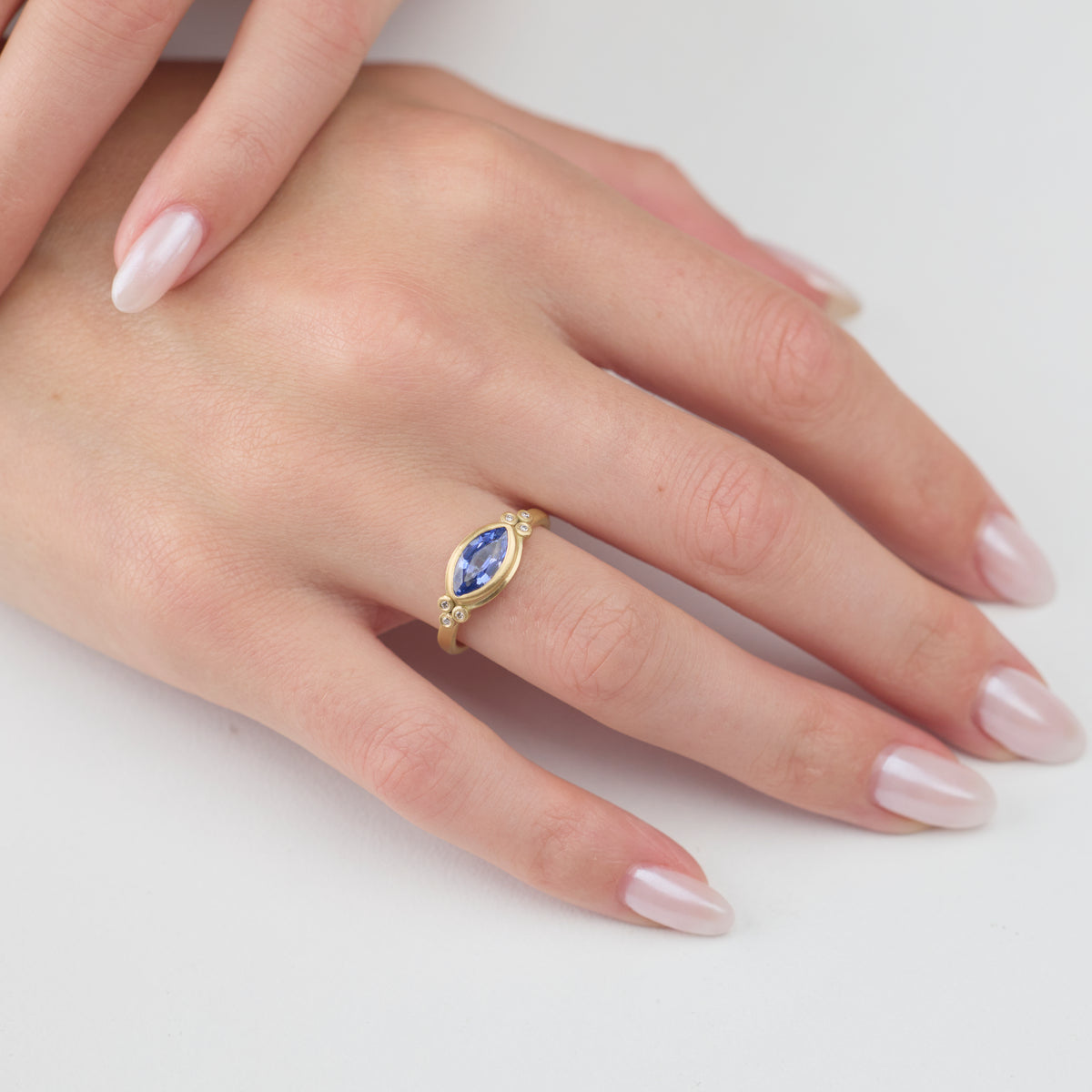 Blue Sapphire Marquise Ring with Diamond Trios