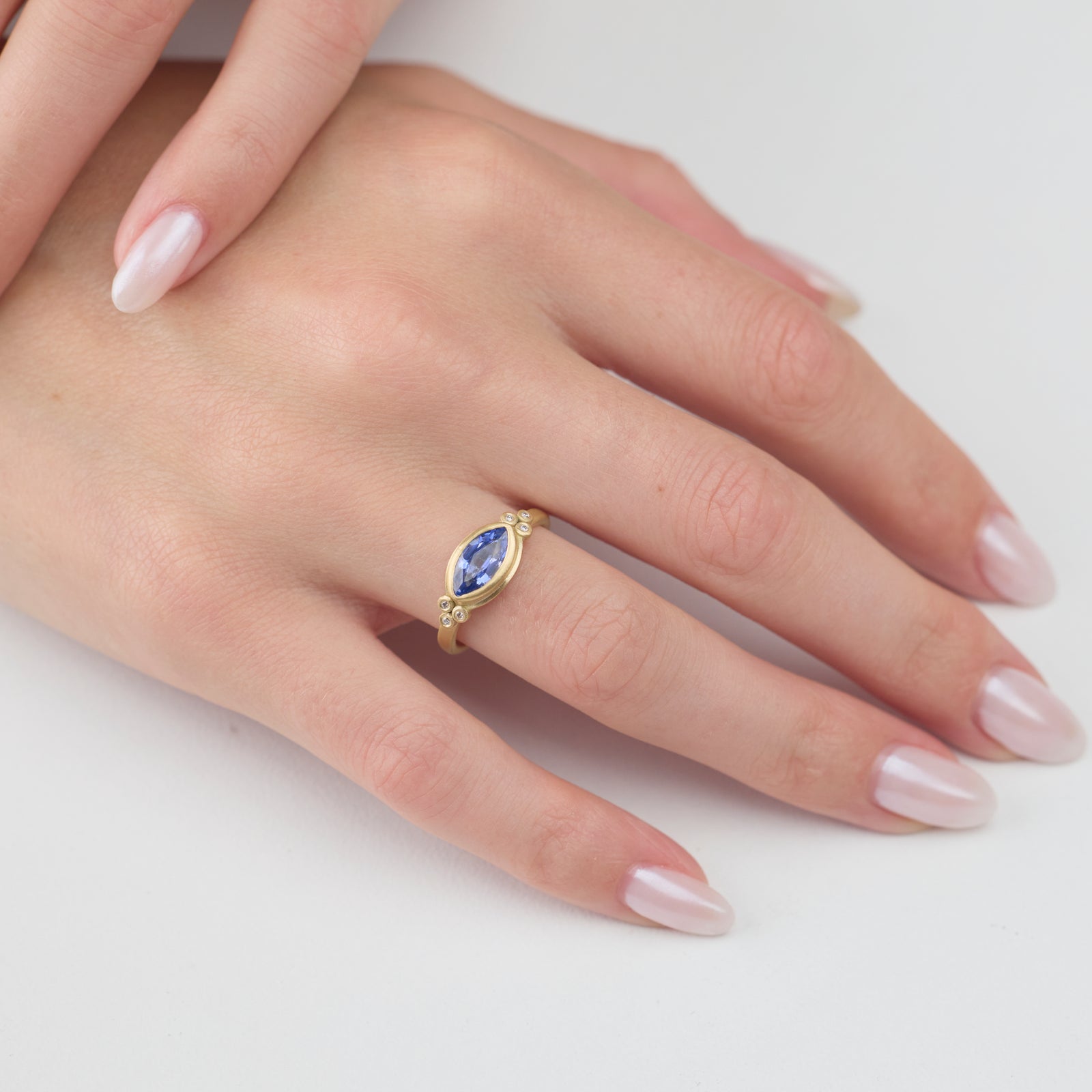 Blue Sapphire Marquise Ring with Diamond Trios