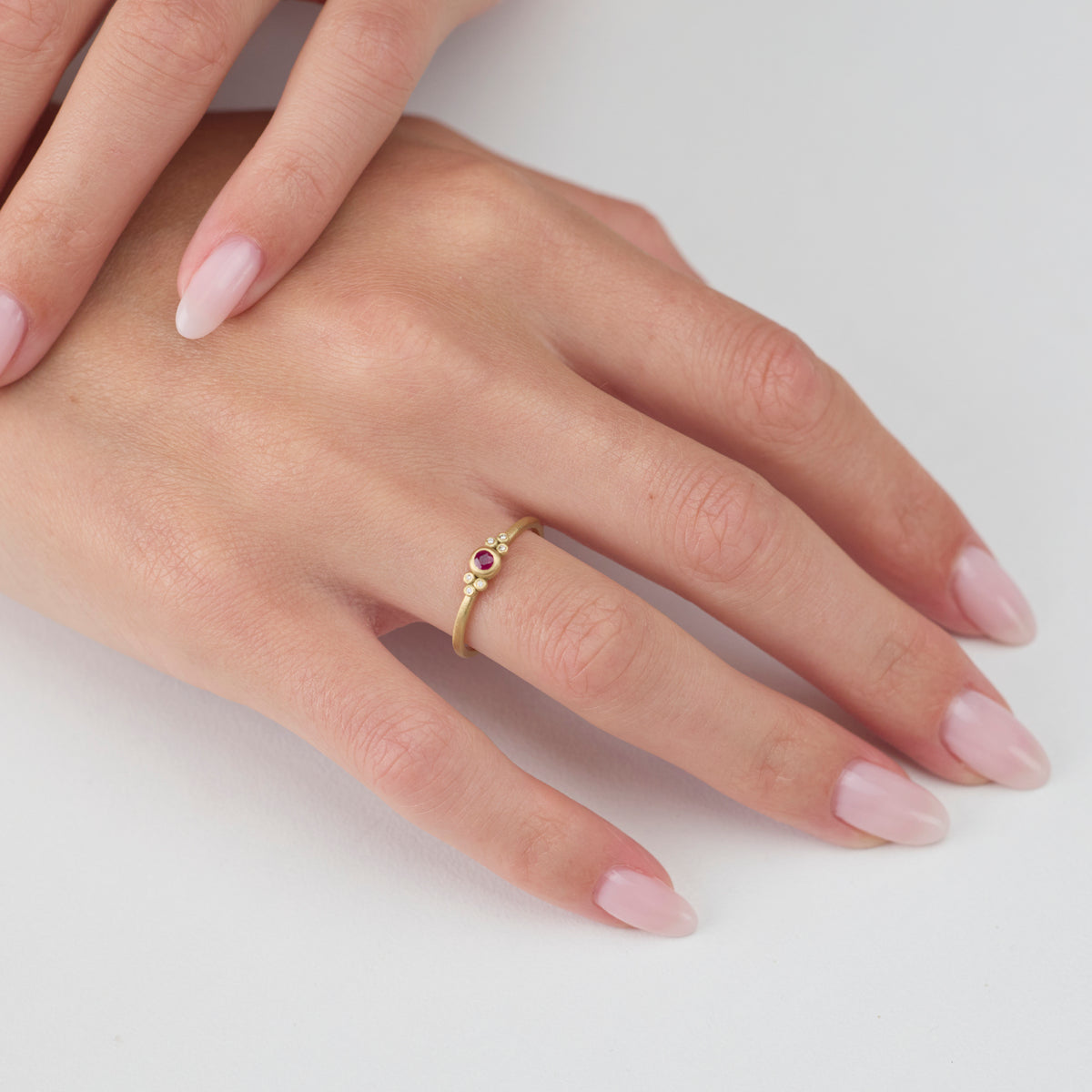 Delicate Ruby Ring with Diamond Trios