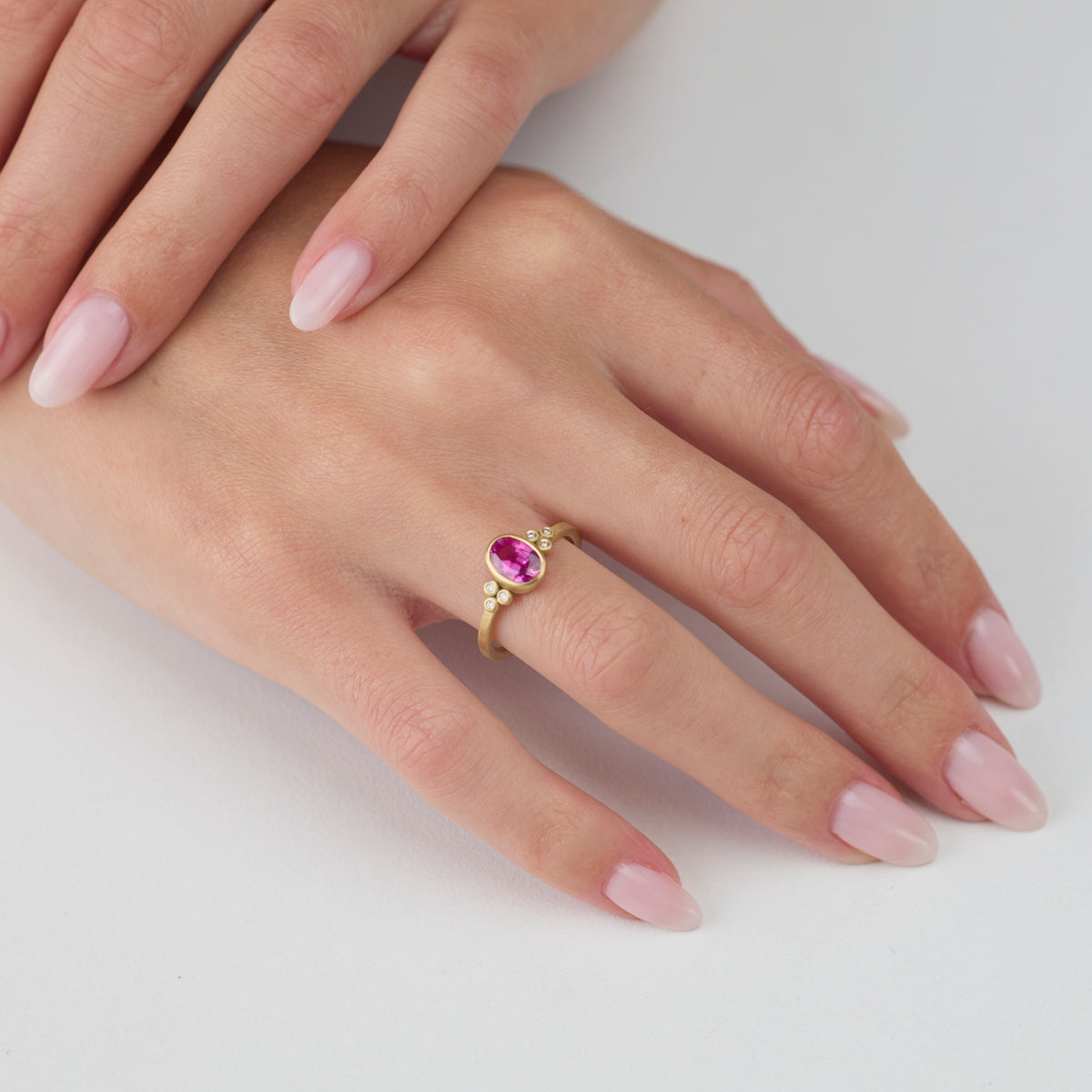 Magenta Sapphire Oval Ring with Diamonds