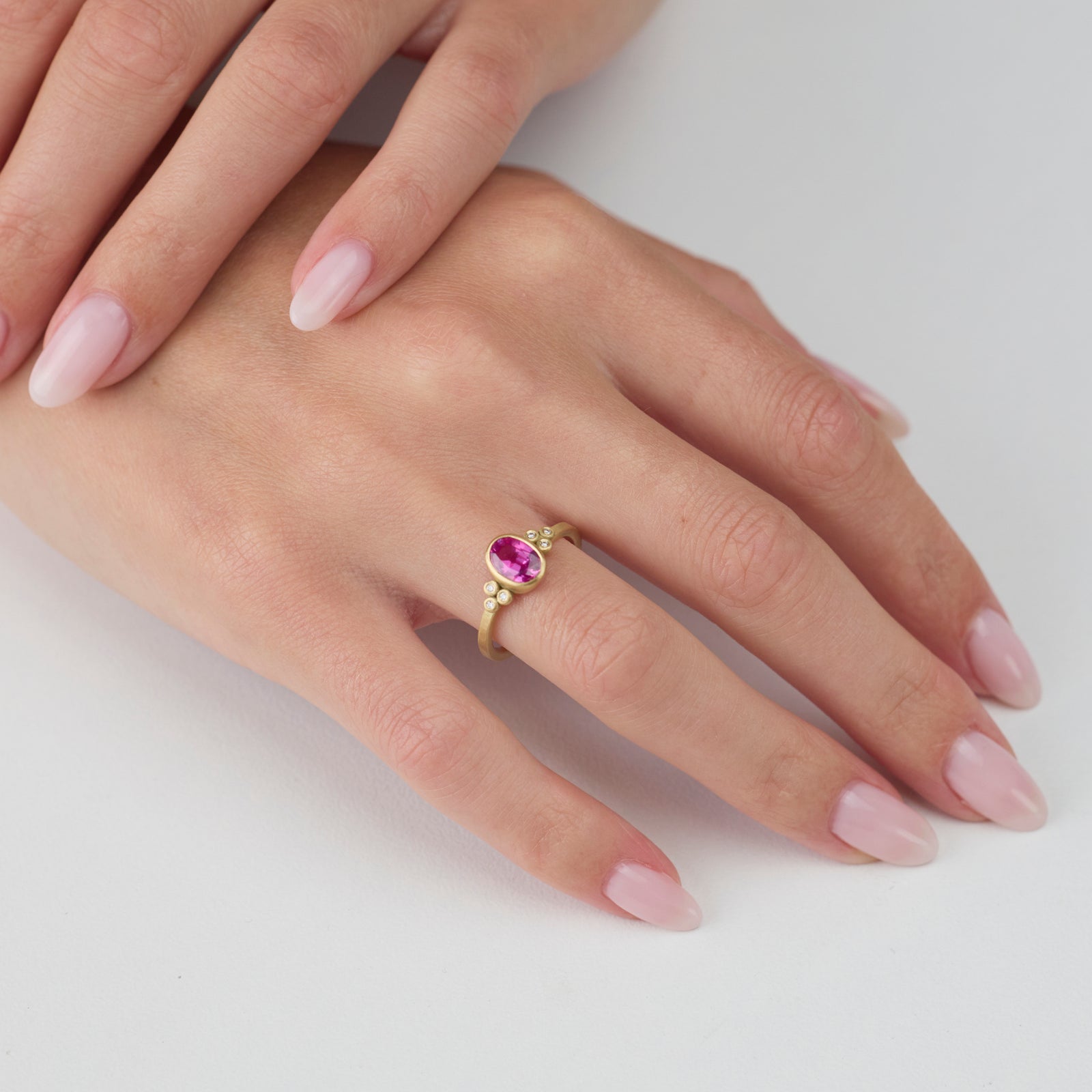Magenta Sapphire Oval Ring with Diamonds