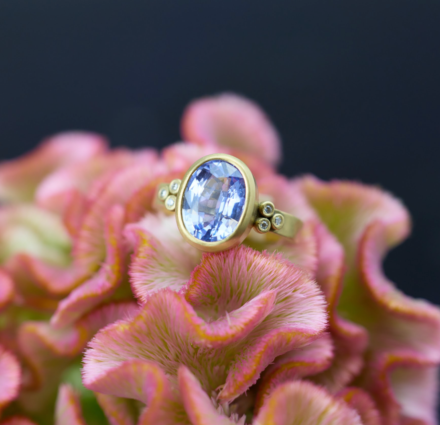 Oval Sapphire Ring with Diamond Trios