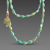 Long Turquoise Necklace with Gold Trio Charm