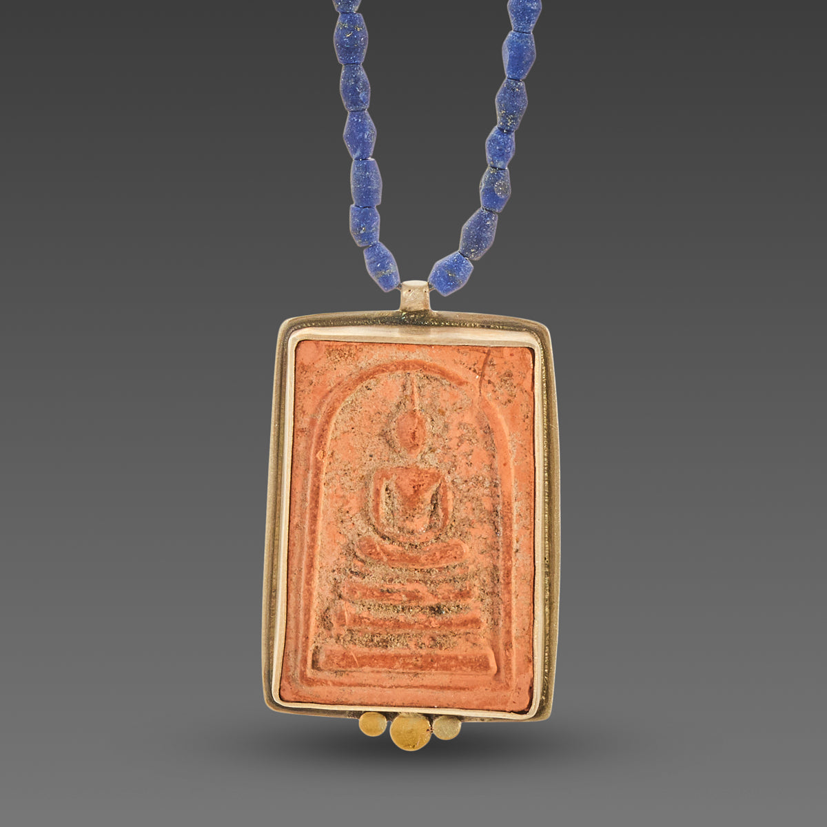 Buddha Amulet on Lapis Strand