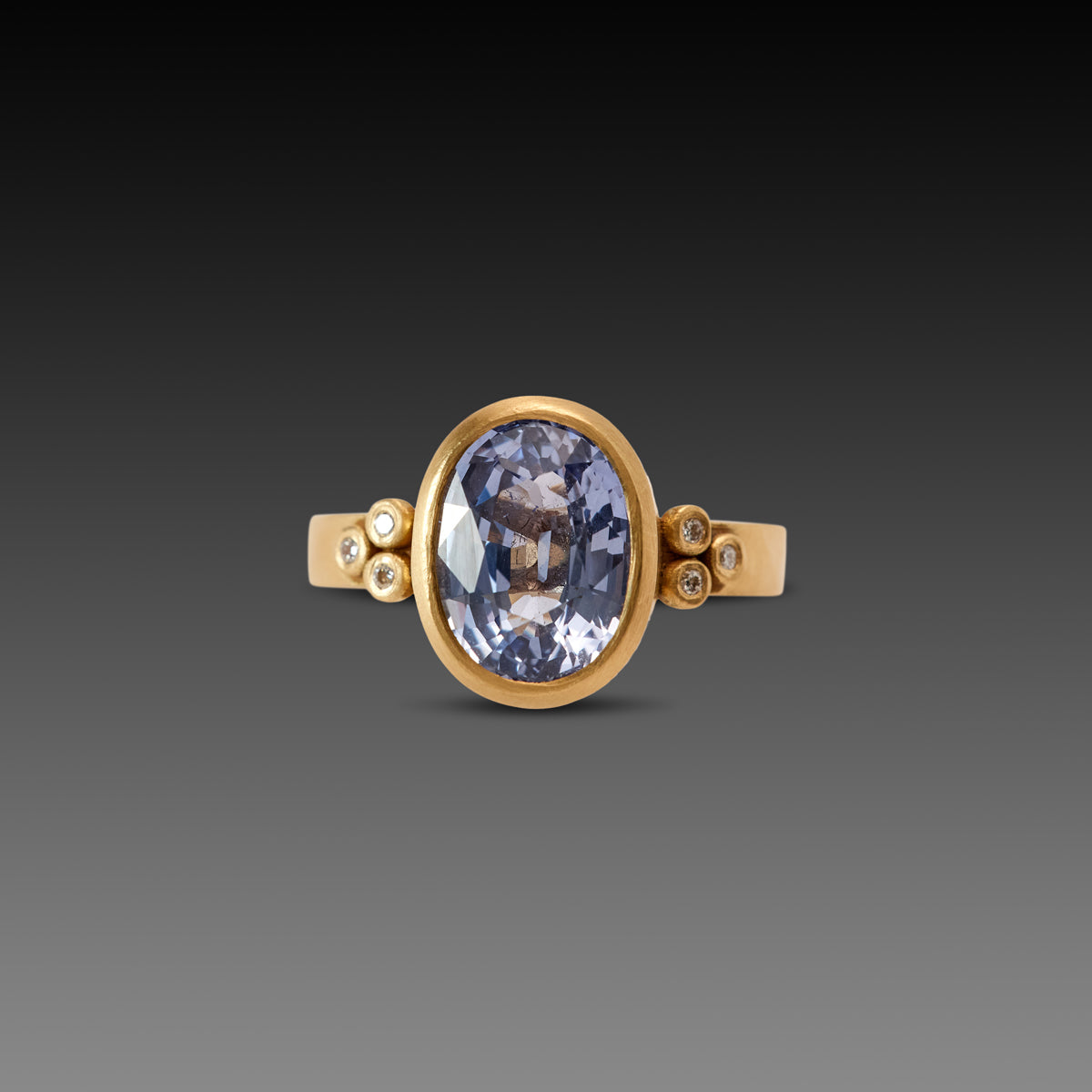 Oval Sapphire Ring with Diamond Trios