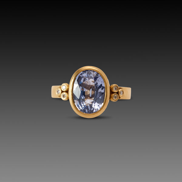 Oval Sapphire Ring with Diamond Trios