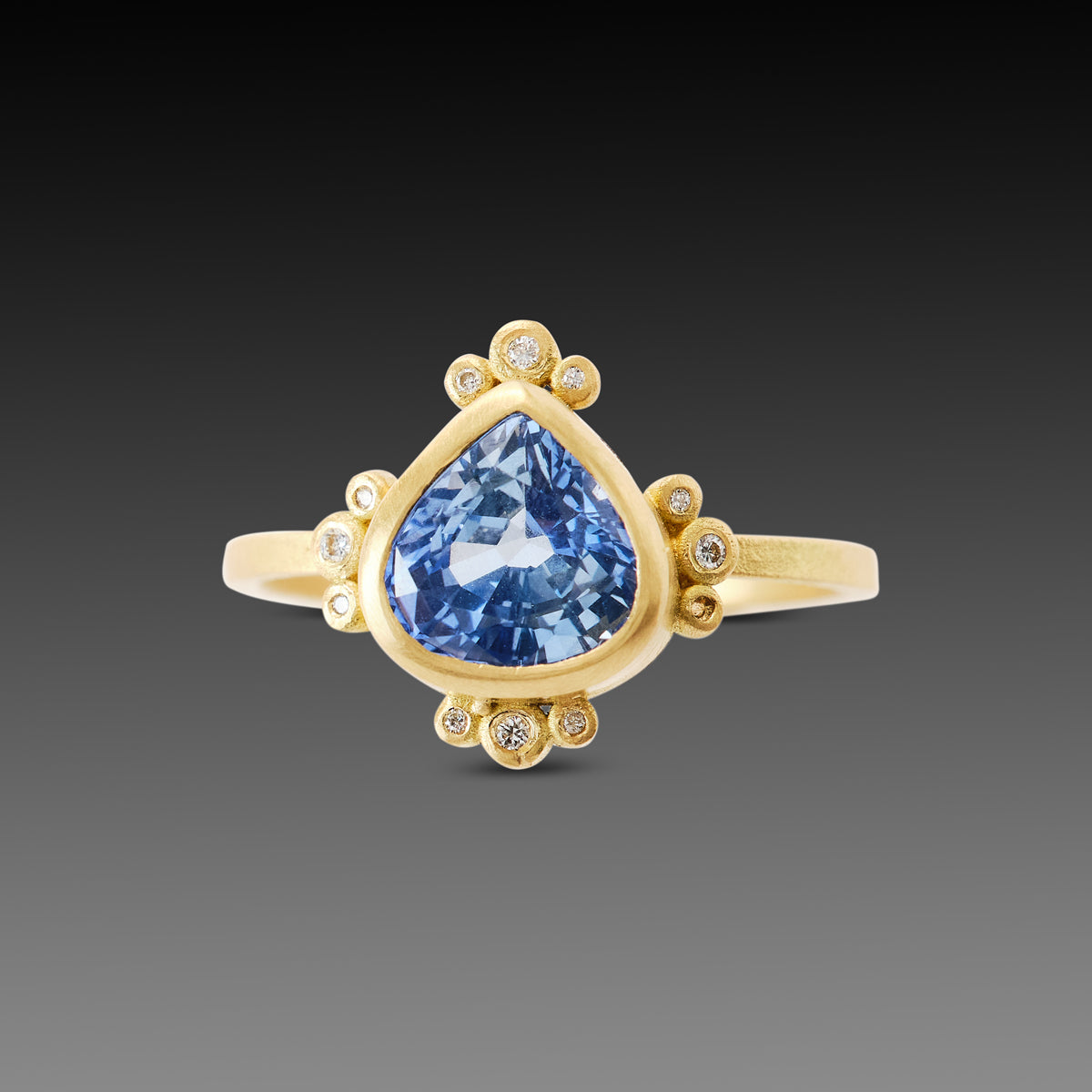 Pear Sapphire Ring with Diamond Trios